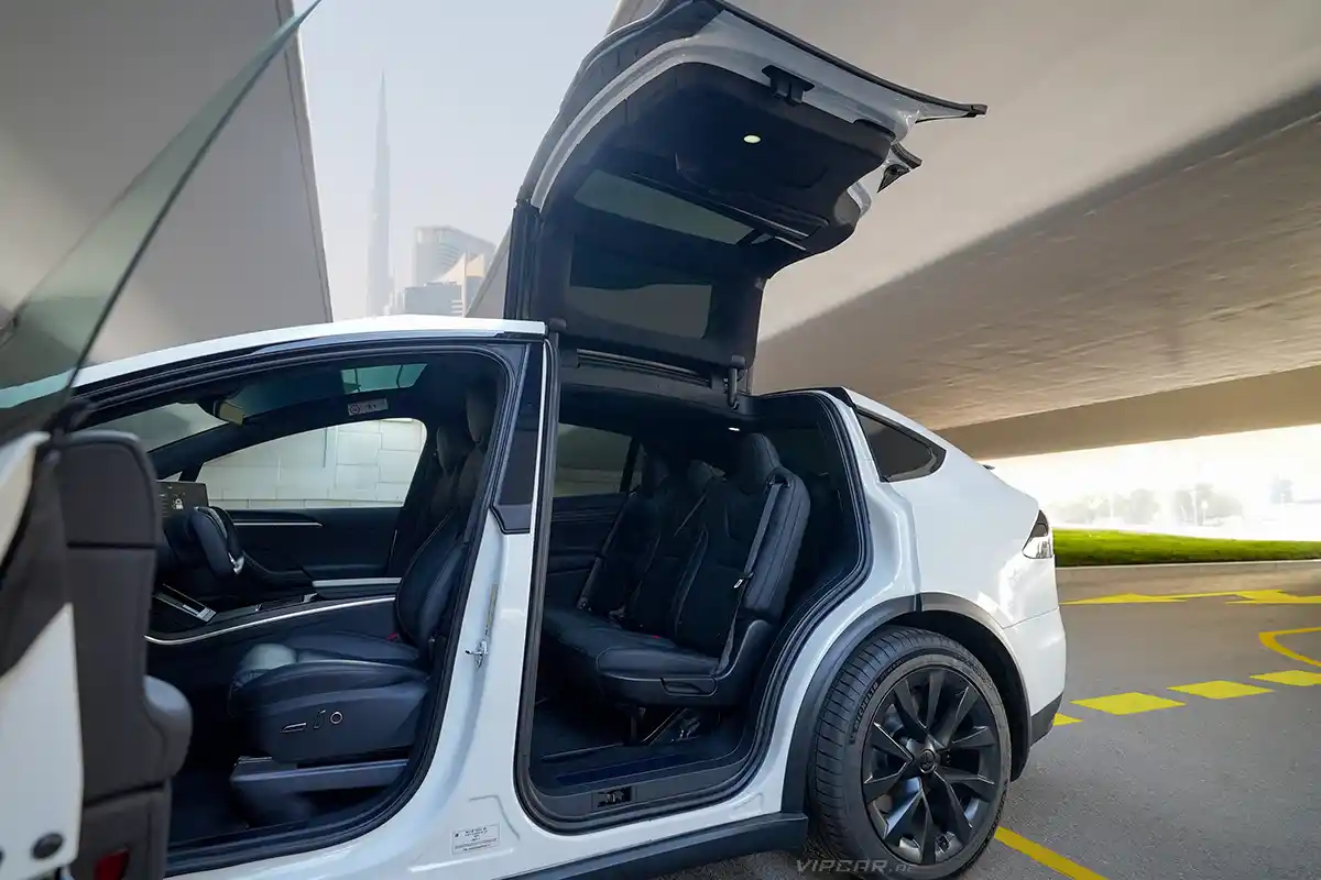 Tesla Parked with open Doors